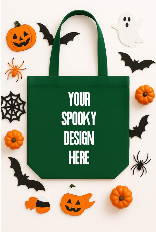 Green tote bag with 'Your Spooky Design Here' text, surrounded by Halloween decorations on a white background.