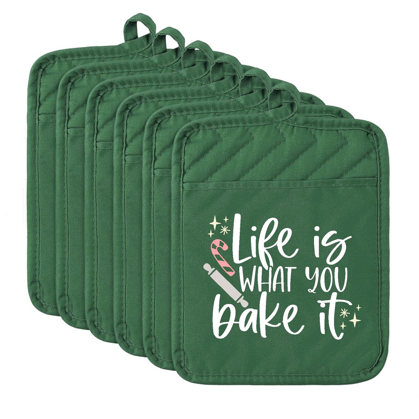 Set of green pot holders with 'Life is what you bake it' text on a white background