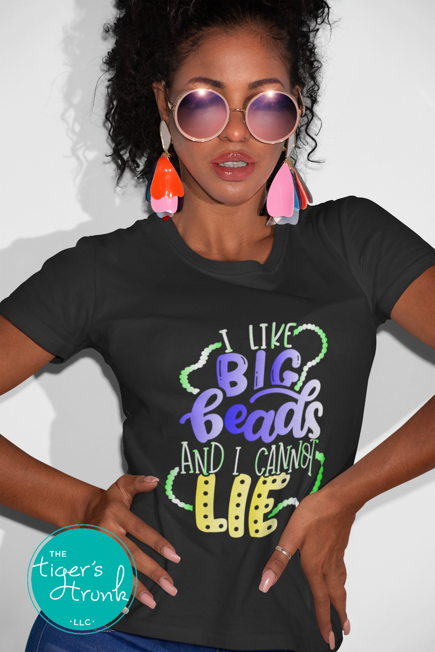 Funny Mardi Gras shirt reading "I Like Big Beads and I Cannot Lie" with a watercolor ombre design in purple, green, and gold.