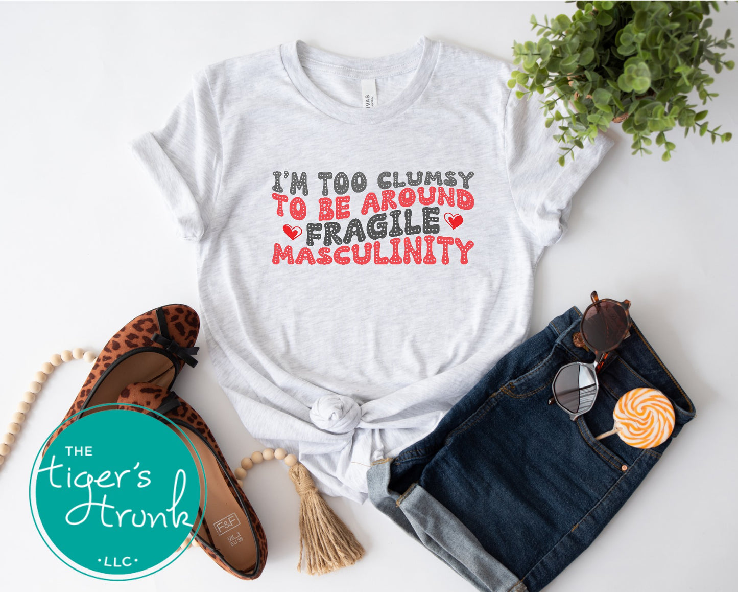 Funny feminist t-shirt with I’m Too Clumsy to Be Around Fragile Masculinity message, bold social commentary apparel