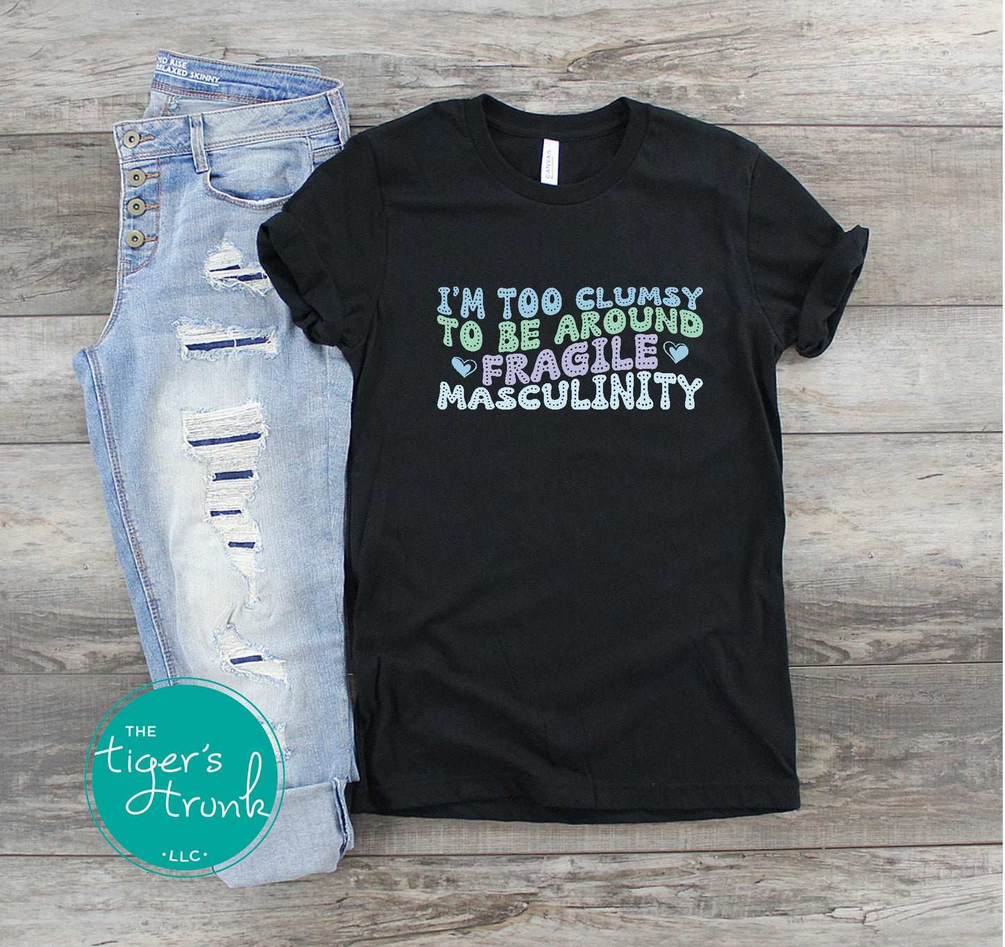 Funny feminist t-shirt with I’m Too Clumsy to Be Around Fragile Masculinity message, bold social commentary apparel