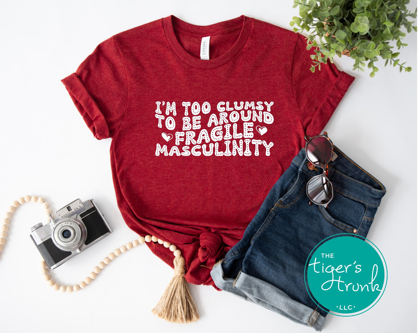 Funny feminist t-shirt with I’m Too Clumsy to Be Around Fragile Masculinity message, bold social commentary apparel