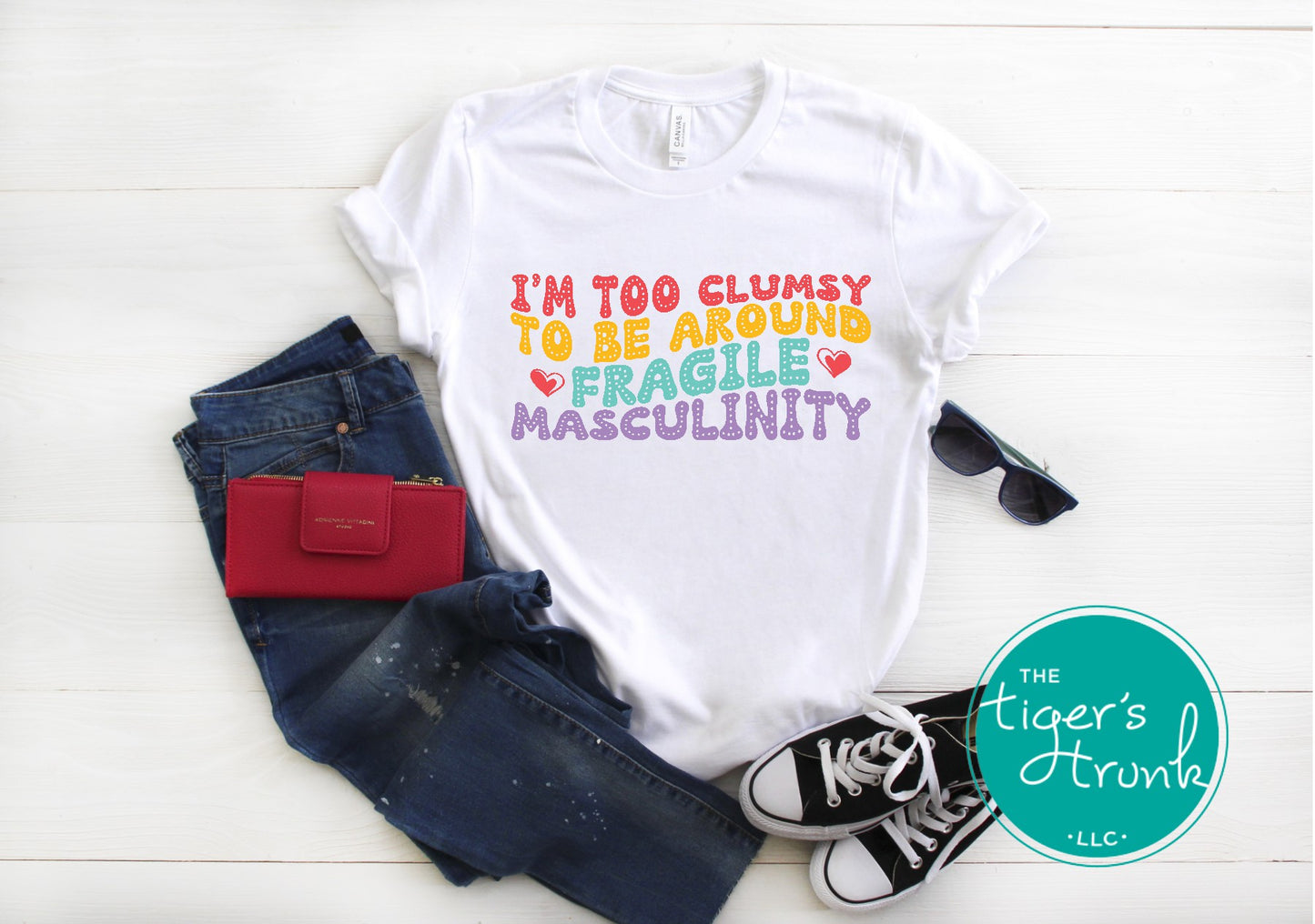 Funny feminist t-shirt with I’m Too Clumsy to Be Around Fragile Masculinity message, bold social commentary apparel