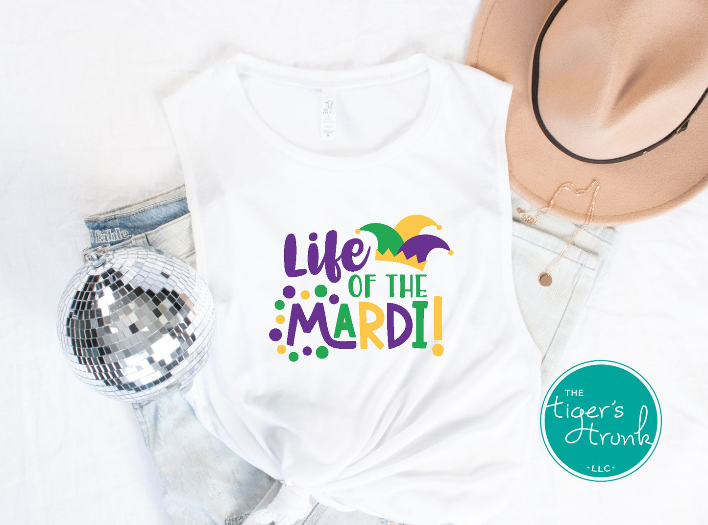 Life of the Mardi shirt with a watercolor design in purple, green, and gold, available as a t-shirt or muscle tank, perfect for Mardi Gras celebrations.