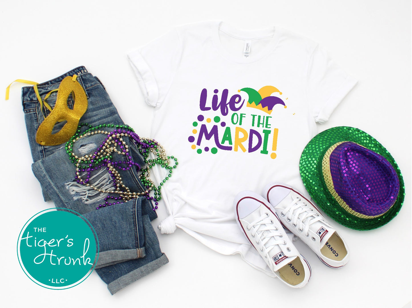 Life of the Mardi shirt with a watercolor design in purple, green, and gold, available as a t-shirt or muscle tank, perfect for Mardi Gras celebrations.