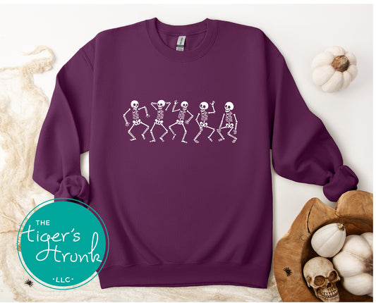 Purple sweatshirt with skeleton design on a white background, featuring 'The Tiger's Horn' logo.