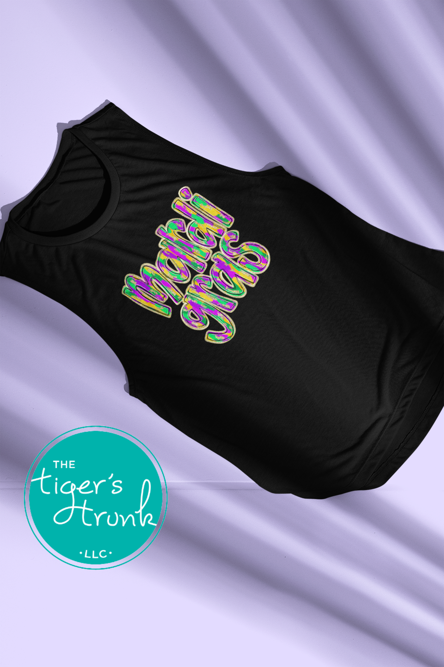 Mardi Gras t-shirt and muscle tank with hand-drawn paintbrush font in purple, green, and gold, perfect for festivals, parades, and celebrations.