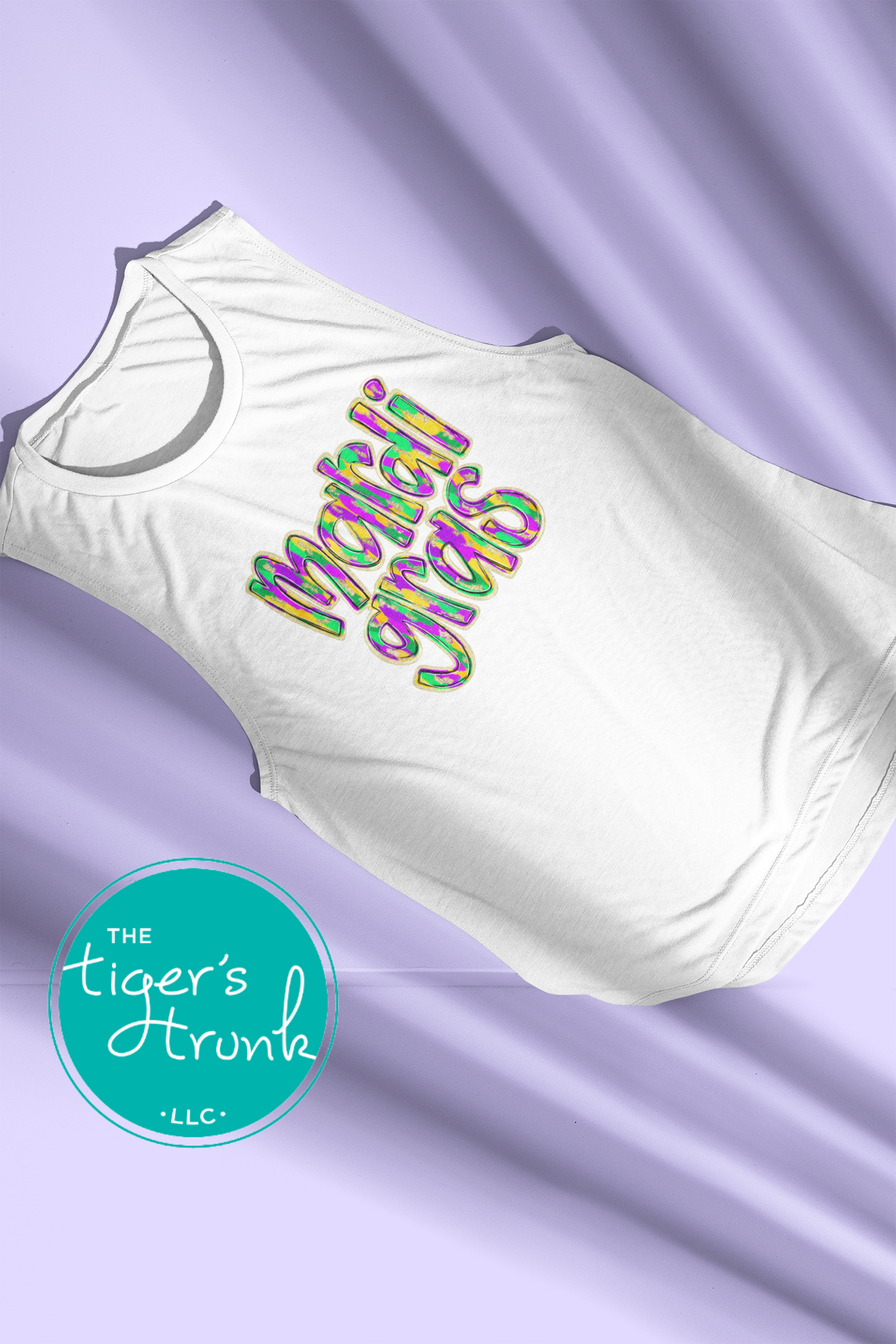 Mardi Gras t-shirt and muscle tank with hand-drawn paintbrush font in purple, green, and gold, perfect for festivals, parades, and celebrations.