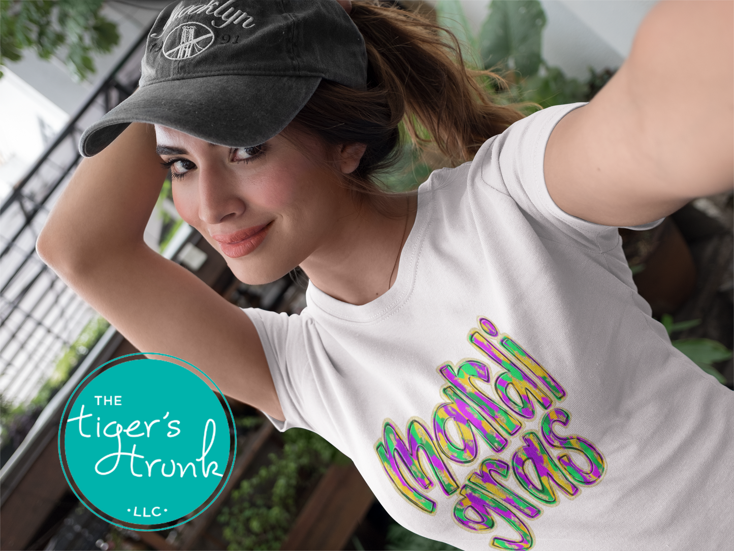 Mardi Gras t-shirt and muscle tank with hand-drawn paintbrush font in purple, green, and gold, perfect for festivals, parades, and celebrations.