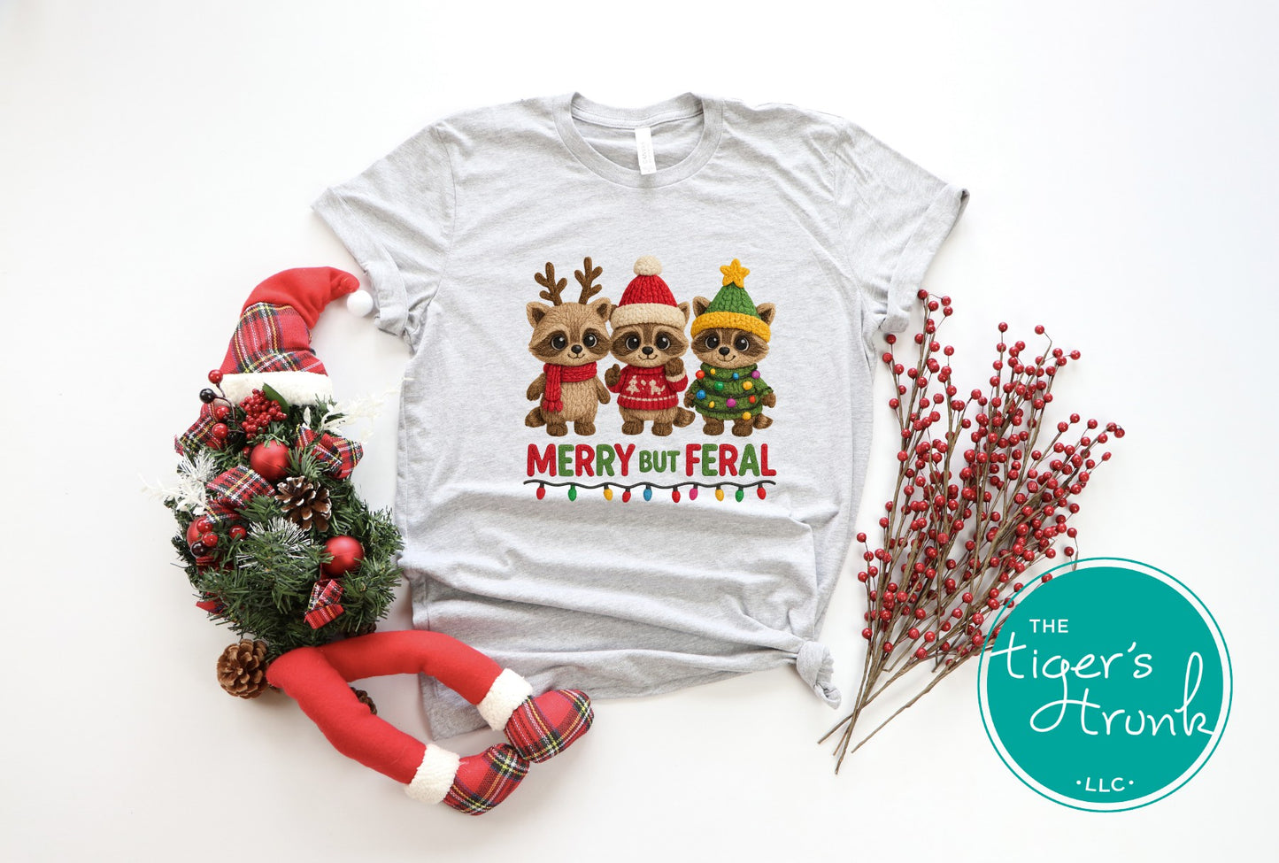 Gray t-shirt with Christmas-themed design featuring reindeer, surrounded by festive decorations on a white background.