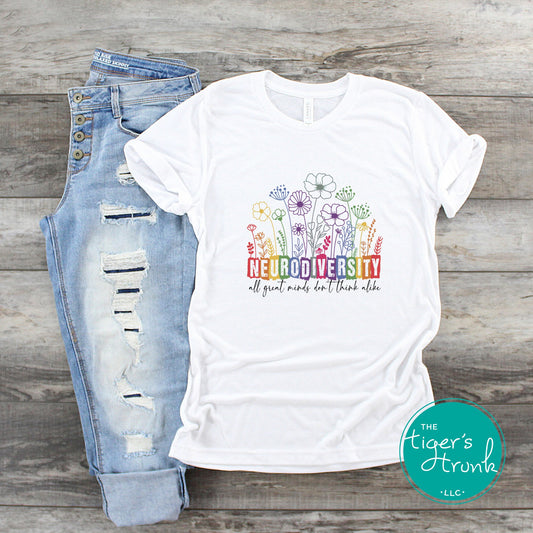 T-shirt with floral design and the phrase "All Great Minds Don’t Think Alike," promoting neurodivergent pride and mental health awareness