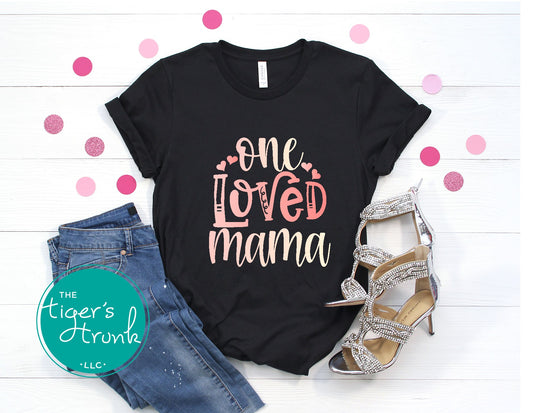 One Loved Mama Valentine’s Day shirt, a cute and casual holiday t-shirt for moms, perfect for family gatherings or everyday wear.