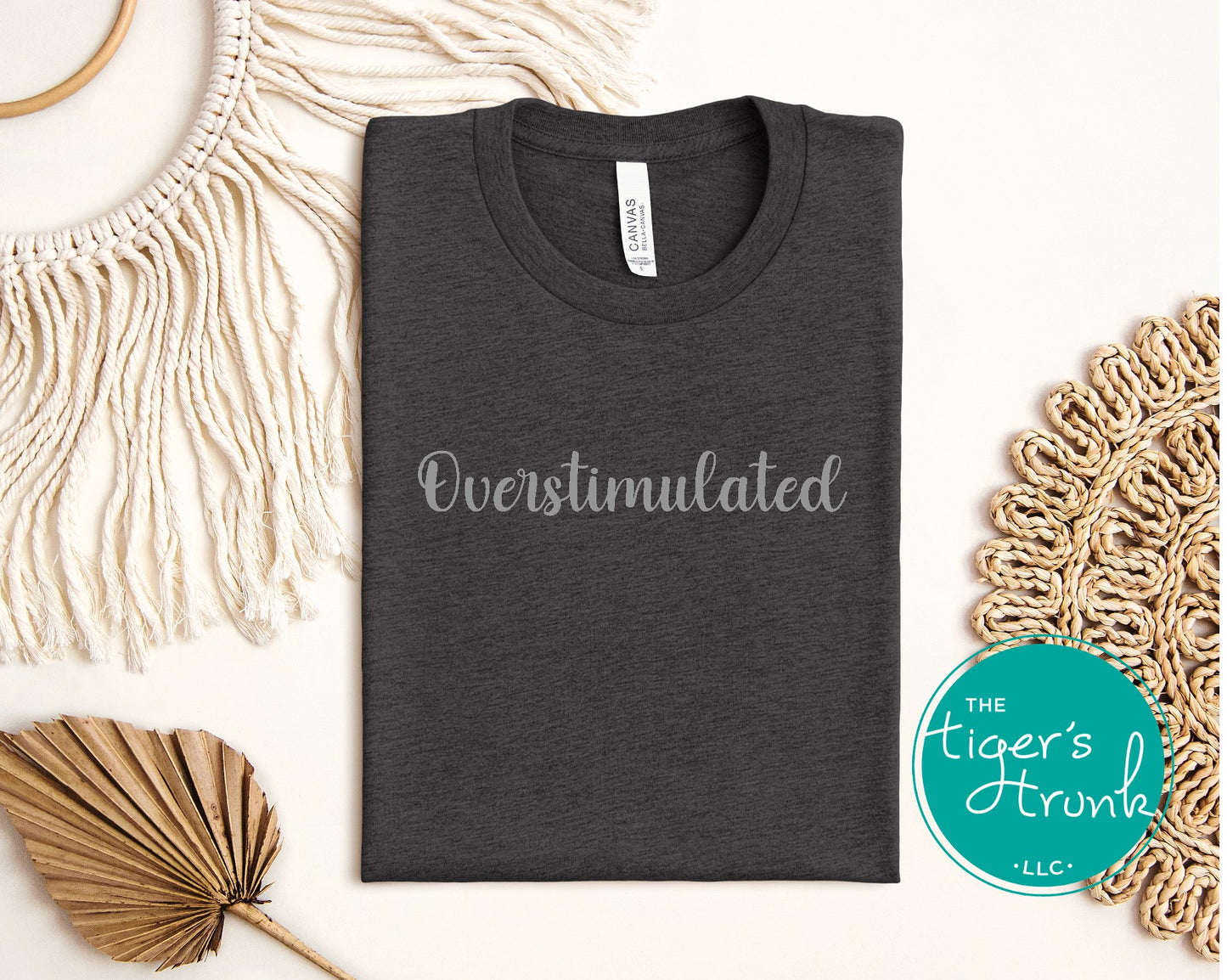 Dark gray overstimulated graphic t-shirt flat lay