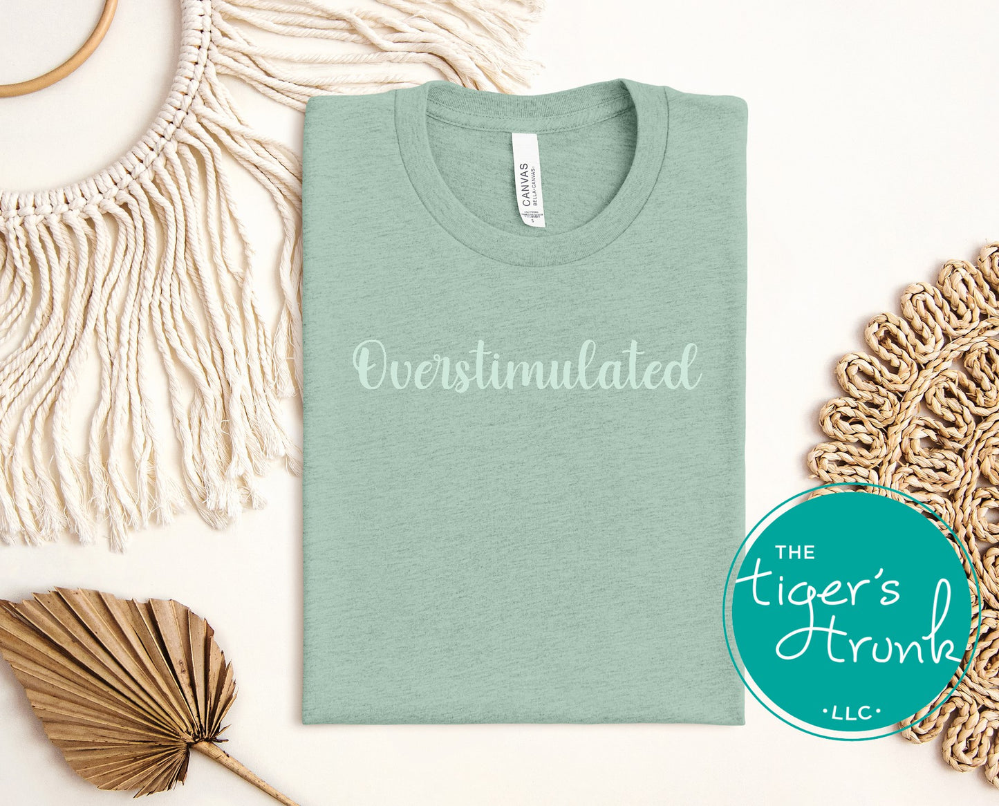 Sage green overstimulated text graphic tee