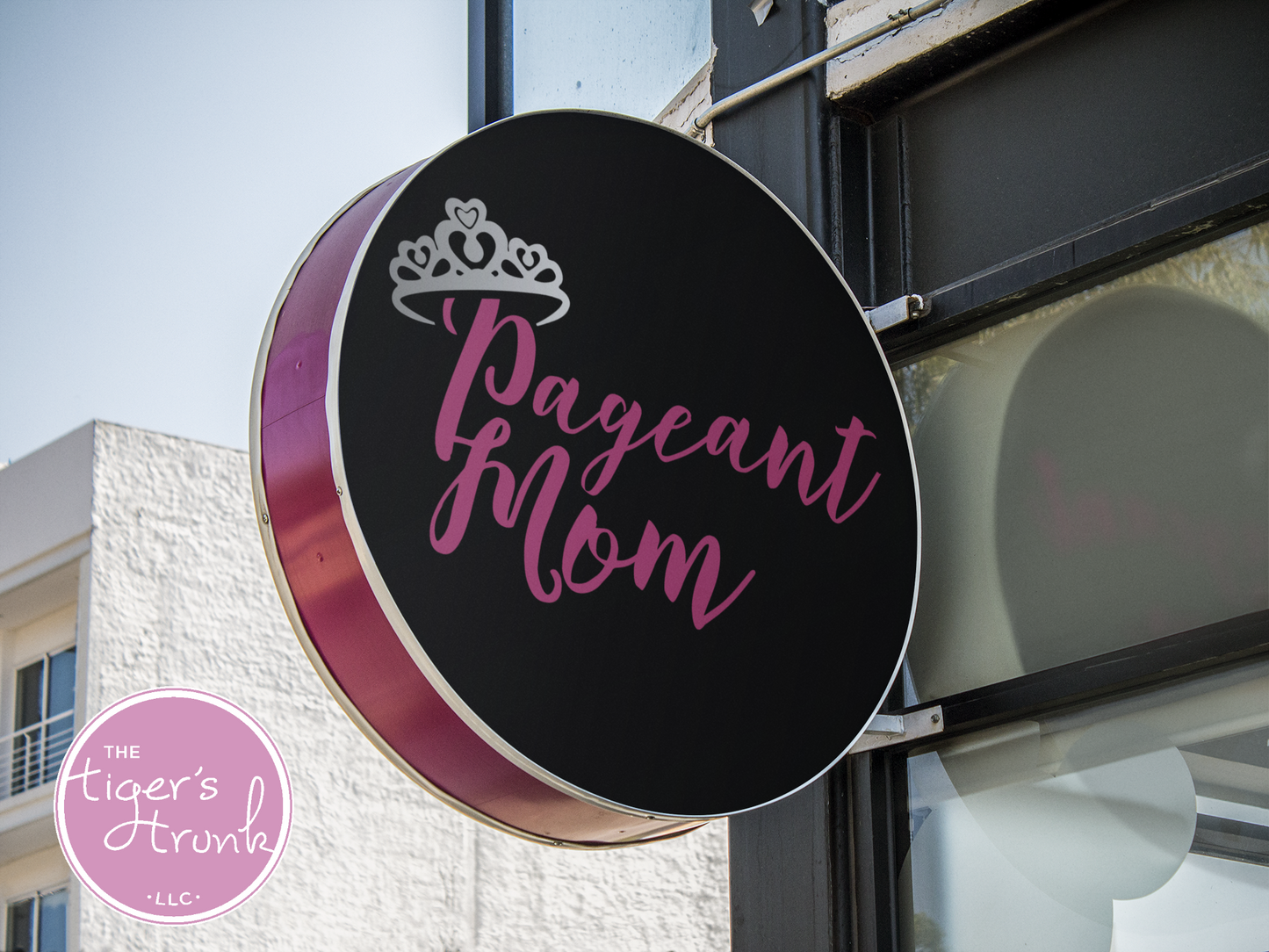 Round storefront sign with Pageant Mom logo and tiara