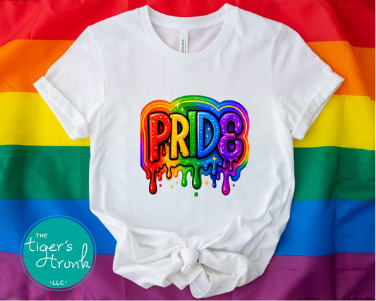 White t-shirt with colorful paint-drip rainbow design and the word “Pride,” LGBTQ+ shirt for queer visibility and ally support