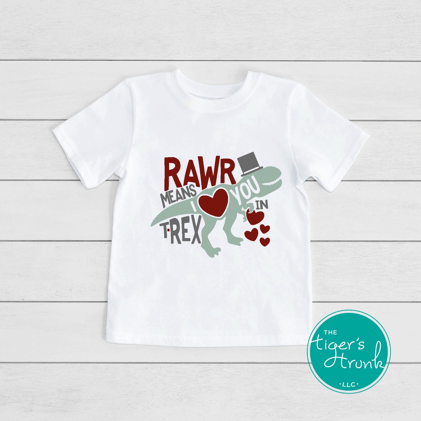 Kids Valentine’s Day t-shirt with a playful T-Rex graphic and the phrase Rawr Means I Love You in T-Rex, perfect for dinosaur fans.