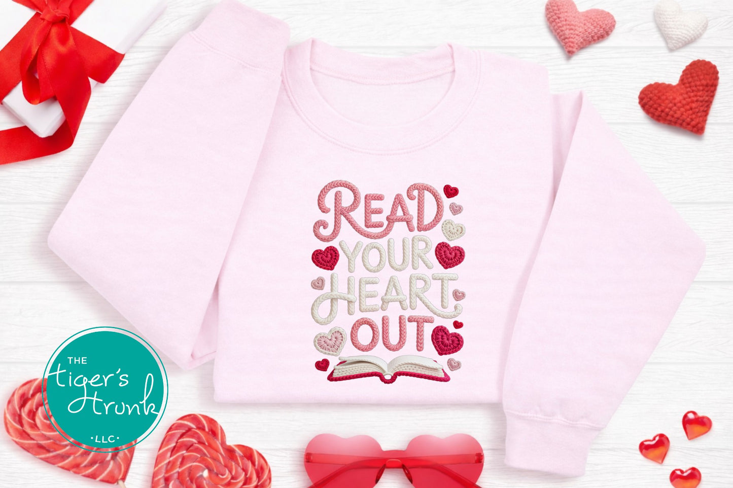 Pink children's shirt with 'Read Your Heart Out' text on a white background with hearts and candy.