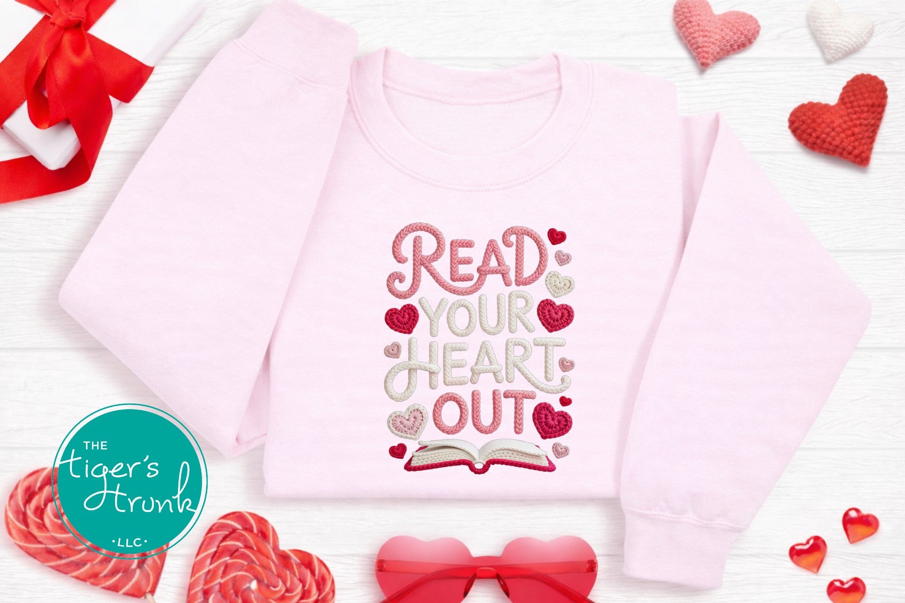Pink children's shirt with 'Read Your Heart Out' text on a white background with hearts and candy.