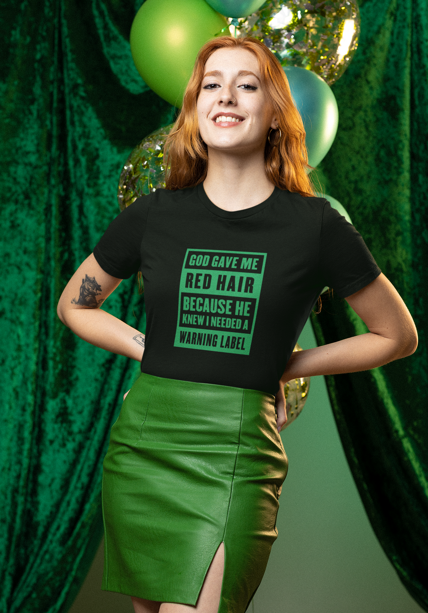 Woman wearing black St. Patrick’s Day red hair warning label shirt with green lettering.