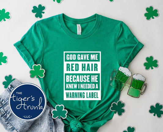 elly green St. Patrick’s Day red hair warning label shirt with shamrock props.