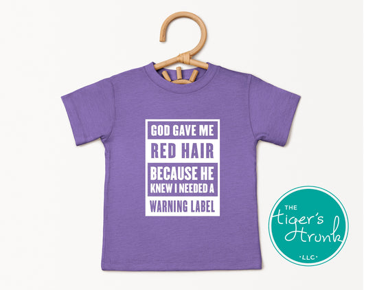 youth purple heather shirt with white text saying god gave me red hair because he knew I needed a warning label