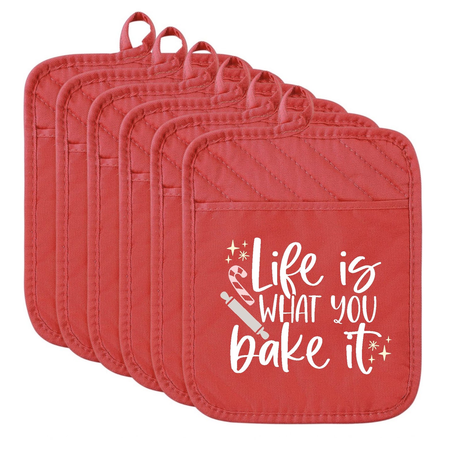 Set of red pot holders with 'Life is what you bake it' text on a white background