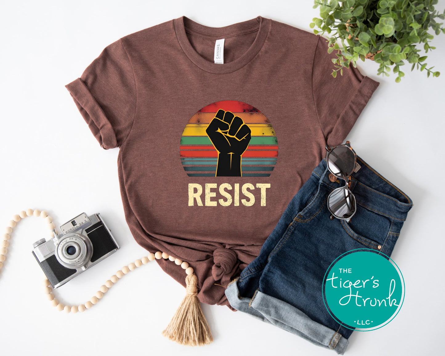 Protest t-shirt with Resist and a bold fist graphic, symbolizing activism and social justice