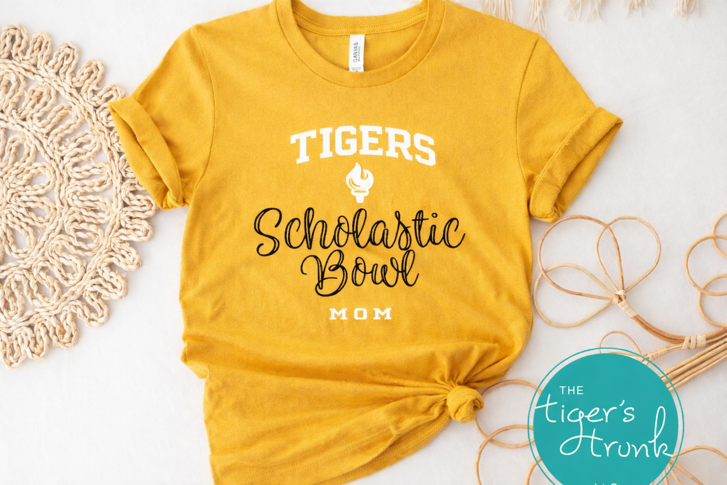 Yellow t-shirt with 'Tigers Scholastic Bowl Mom' text on a white background