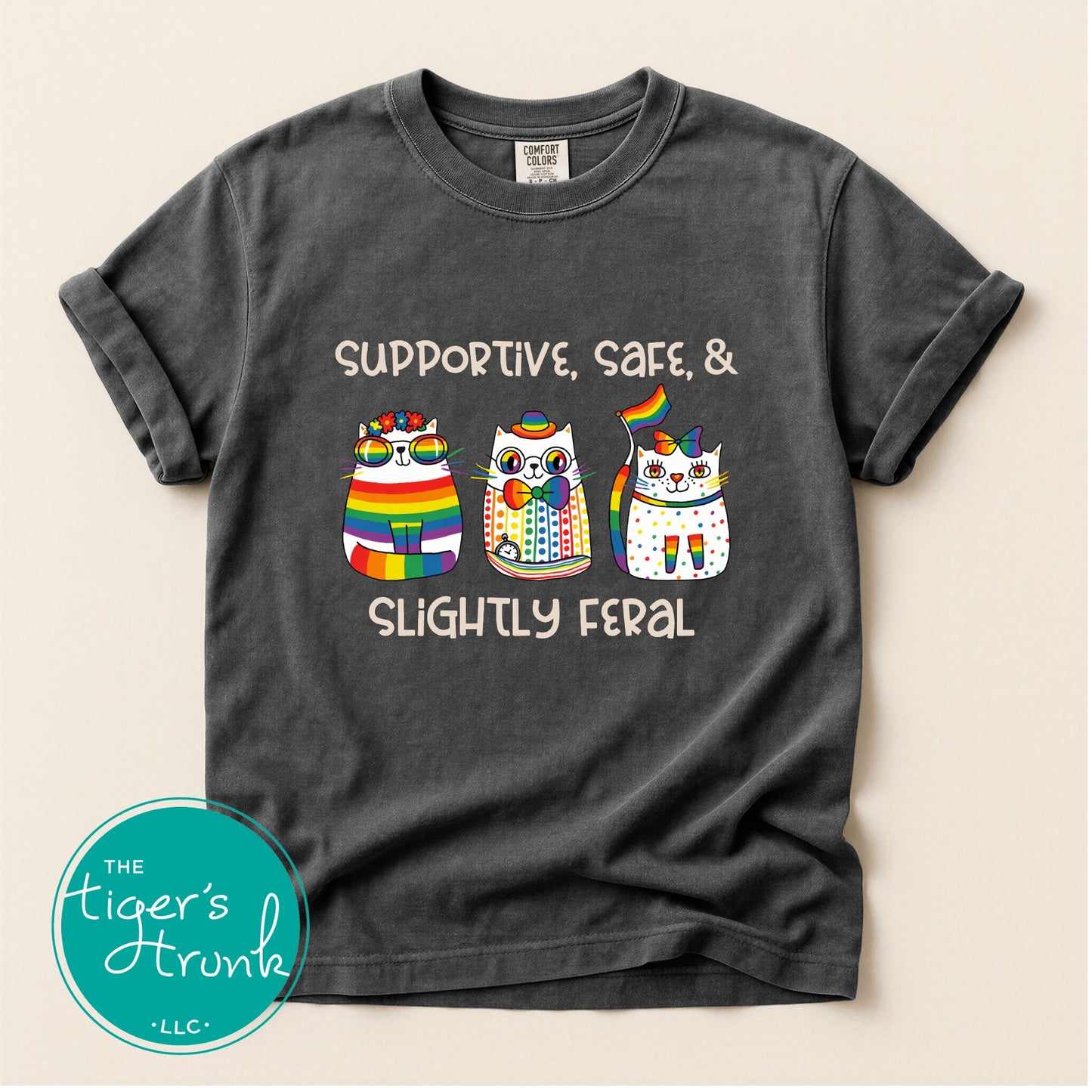 Gray t-shirt with colorful owl design and text on a beige background