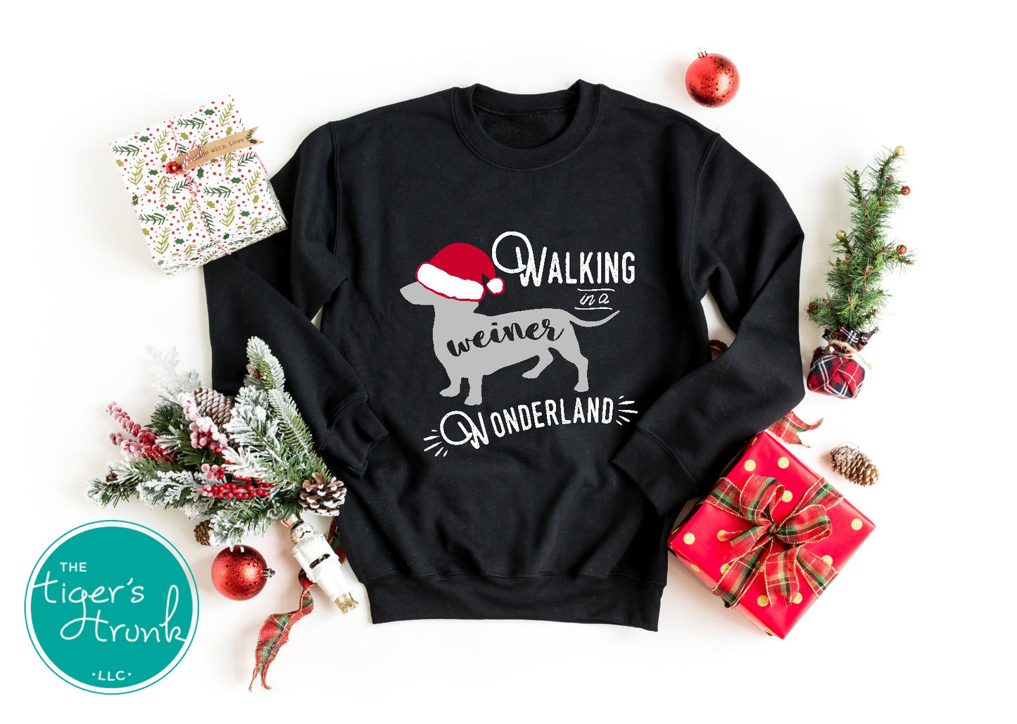 Black sweatshirt with Christmas-themed design on a white background with holiday decorations.