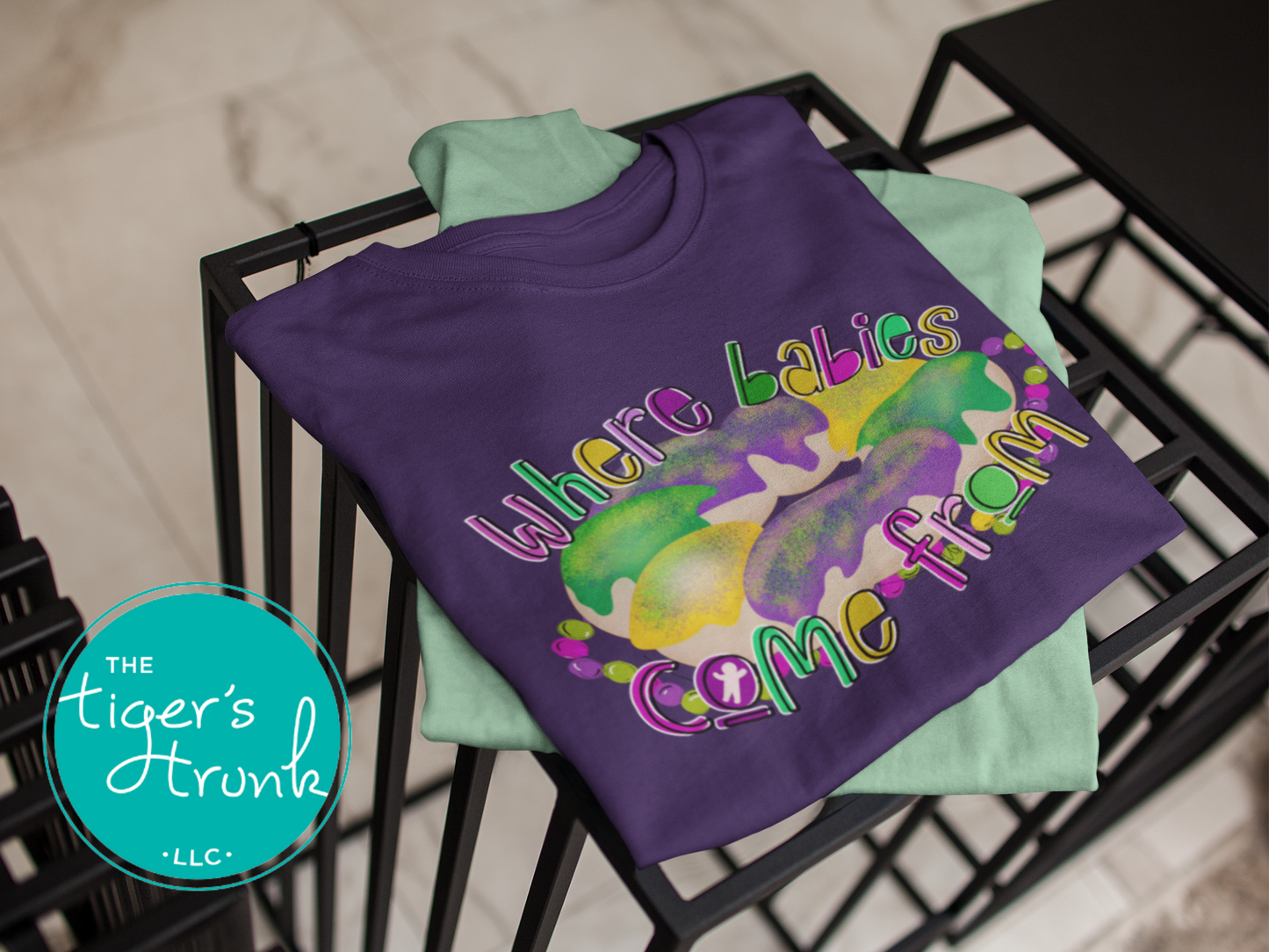 Mardi Gras t-shirt with a watercolor king cake graphic and the phrase Where Babies Come From, perfect for parades and parties.