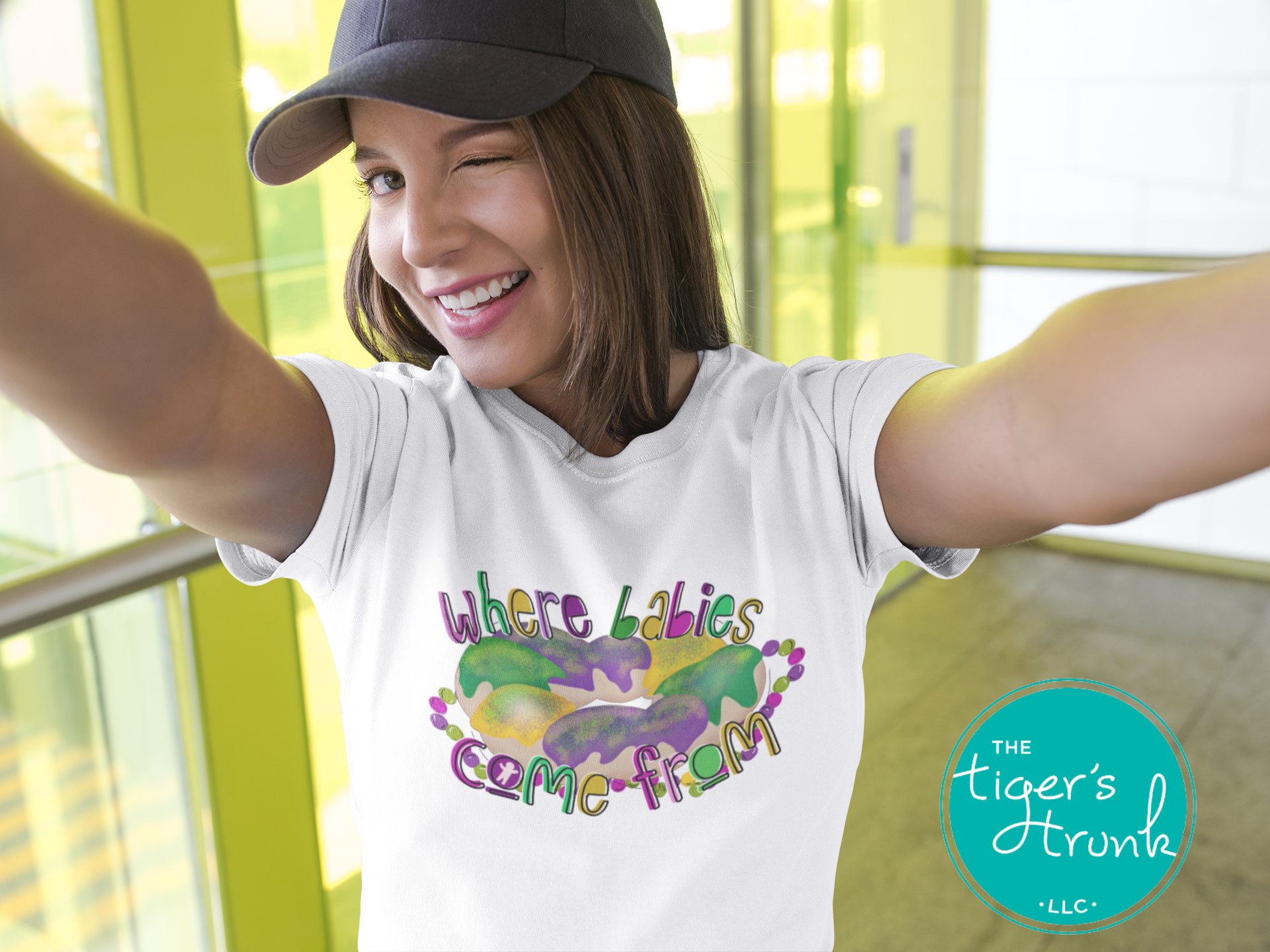 Mardi Gras t-shirt with a watercolor king cake graphic and the phrase Where Babies Come From, perfect for parades and parties.