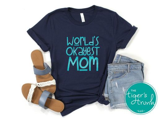 T-shirt with "World’s Okayest Mom" funny and casual design, perfect for Mother's Day, birthdays, or everyday mom life wear