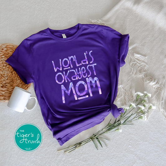 T-shirt with "World’s Okayest Mom" funny and casual design, perfect for Mother's Day, birthdays, or everyday mom life wear