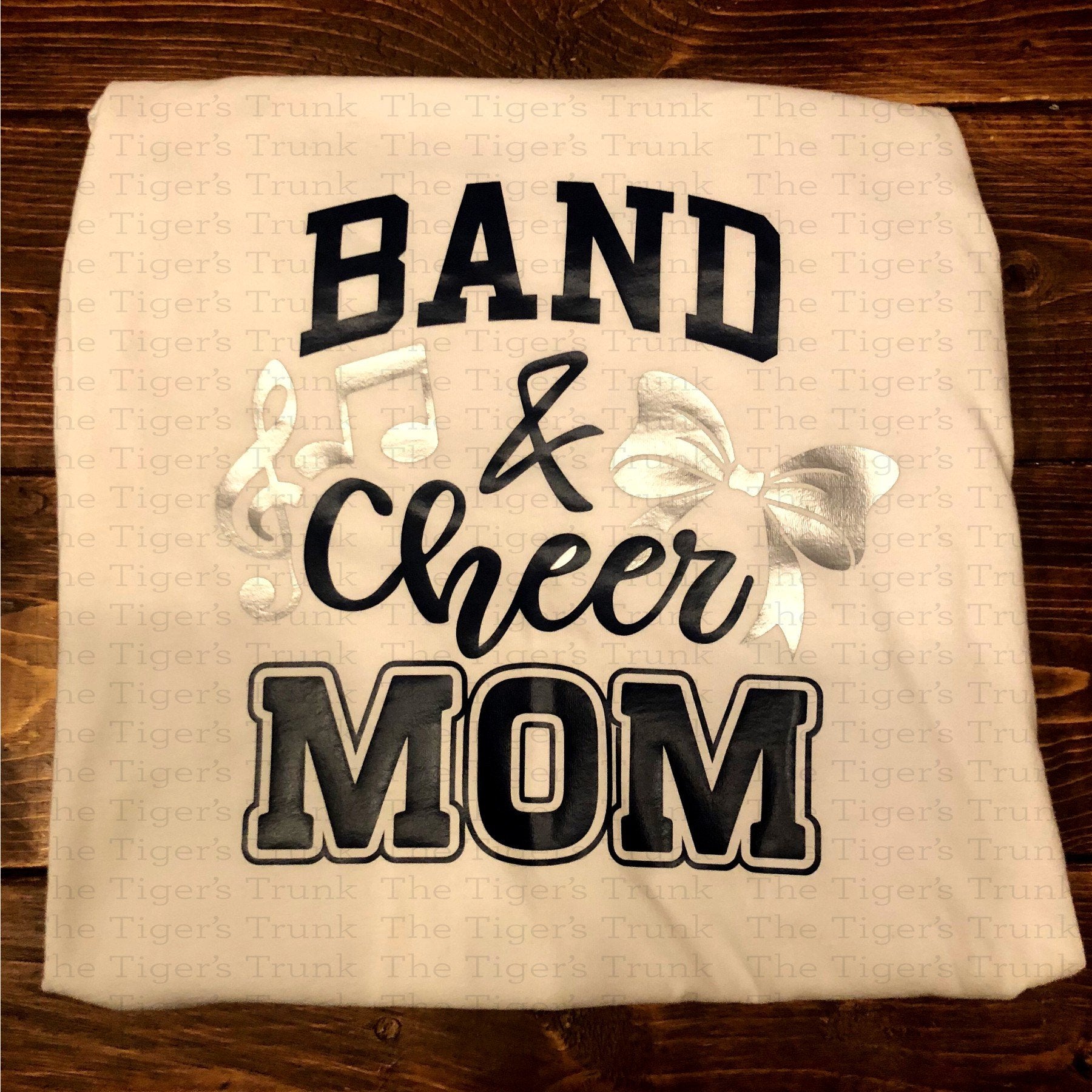 Custom Band and Cheer Mom shirt with bow and music note accents, personalized in school colors for spirited game day wear
