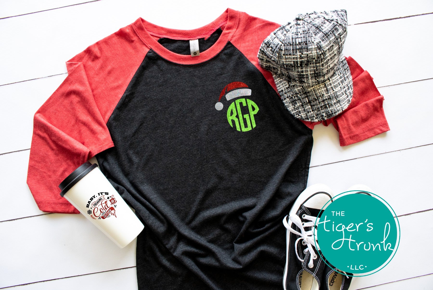 Festive baseball tee with round green monogram and Santa hat design