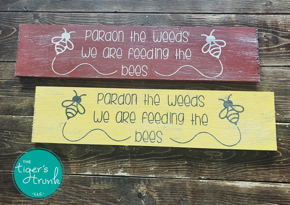 Pardon the Weeds We're Feeding the Bees signs