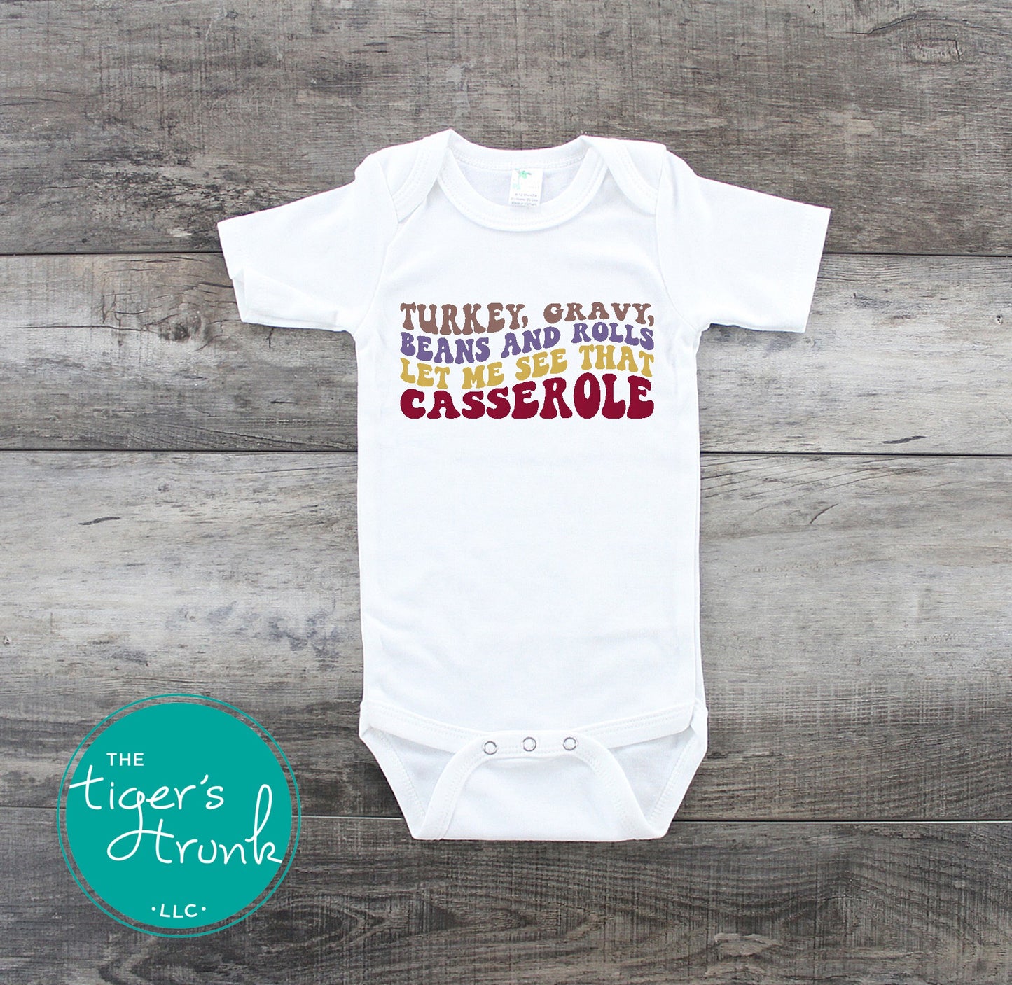 Funny Thanksgiving shirt and baby bodysuit with fall colors and phrase “Turkey, Gravy, Beans and Rolls, Let Me See That Casserole.”