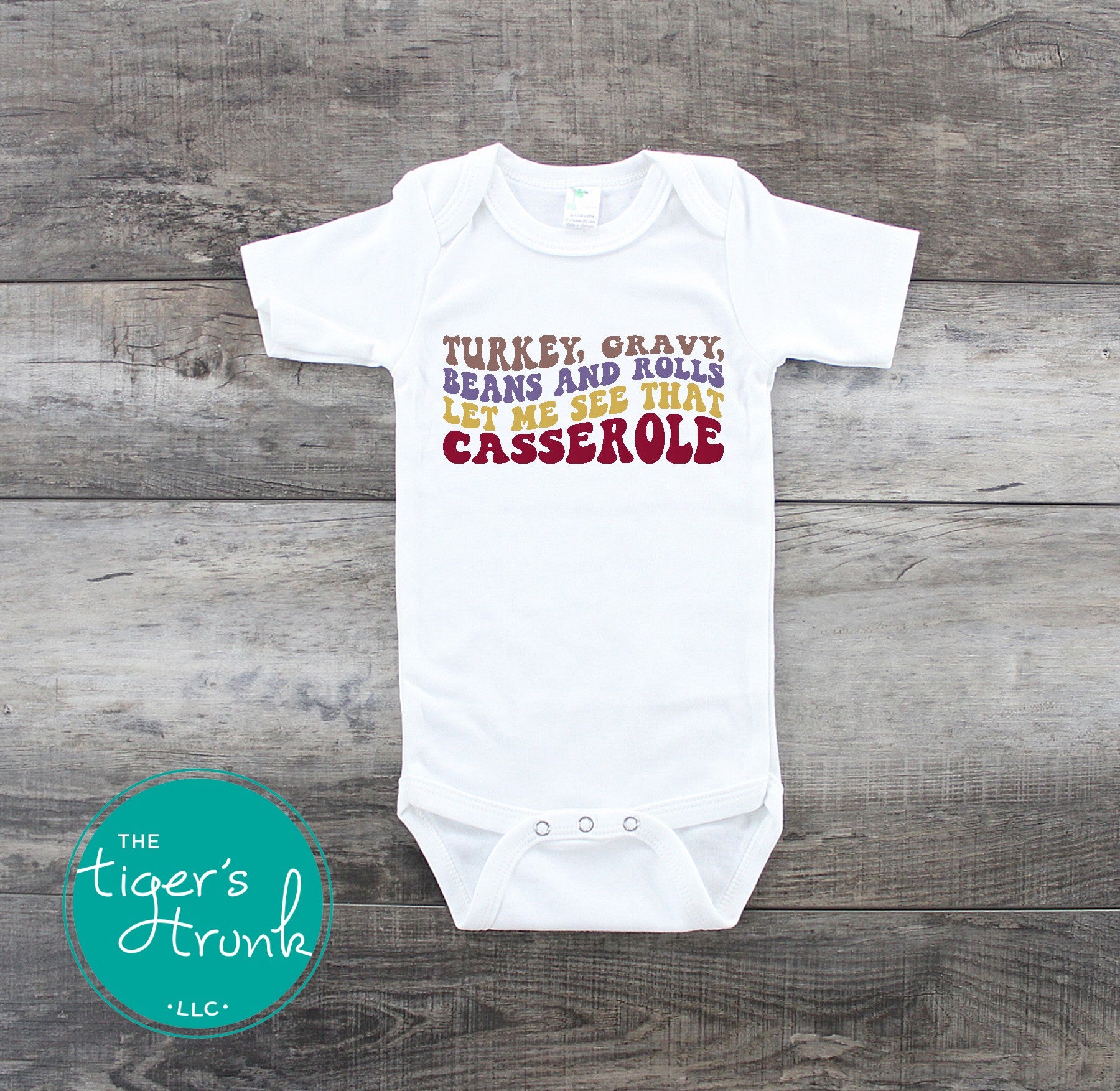 Funny Thanksgiving shirt and baby bodysuit with fall colors and phrase “Turkey, Gravy, Beans and Rolls, Let Me See That Casserole.”