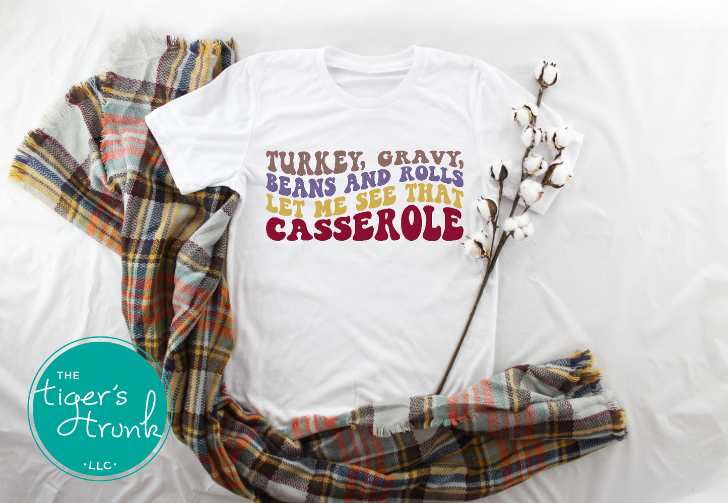 Funny Thanksgiving shirt and baby bodysuit with fall colors and phrase “Turkey, Gravy, Beans and Rolls, Let Me See That Casserole.”